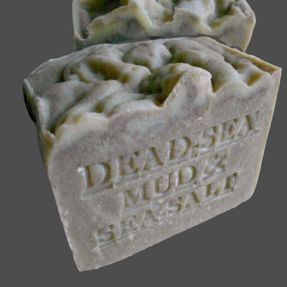 Dead Sea Mud  embossed on its side, indicating its ingredients sourced from the Dead Sea 